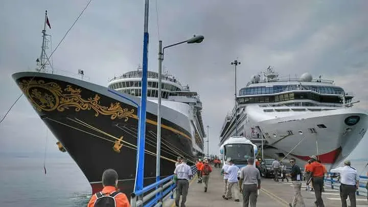 Cruise ships docked on Costa Rica's Pacific coast with Tucanes Tours excursion vehicles waiting