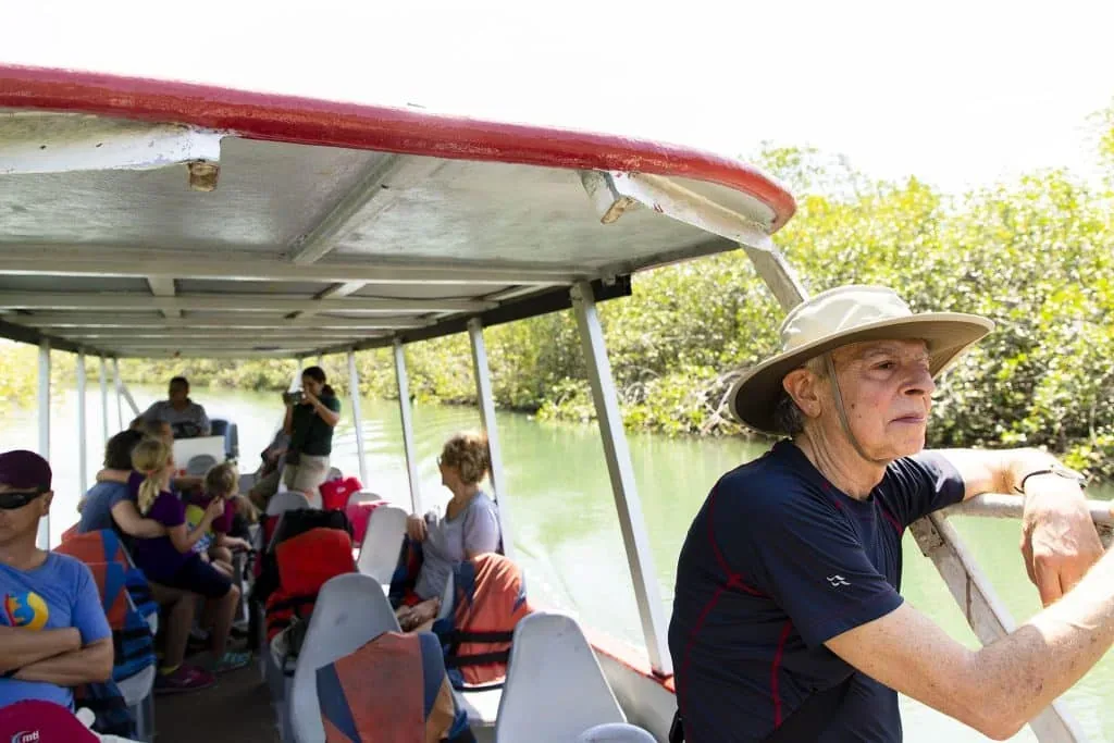 Covered tour boat on the calm water of the Damas estuary