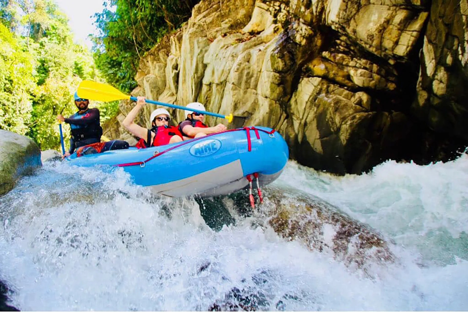 Rafters on the El Chorro River through jungle canyon in Costa Rica