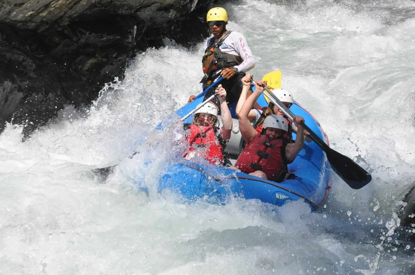 Whitewater rafting between the rock walls of the El Chorro gorge