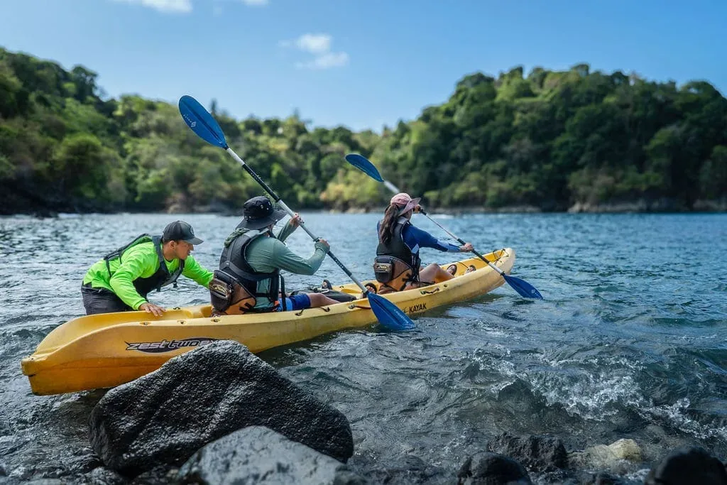 Ocean kayak gliding past tiny islands near Biesanz Bay