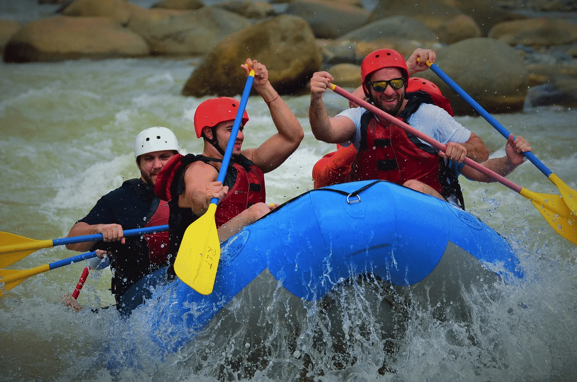 Raft hitting Class III rapids on the Naranjo River near Manuel Antonio, Costa Rica