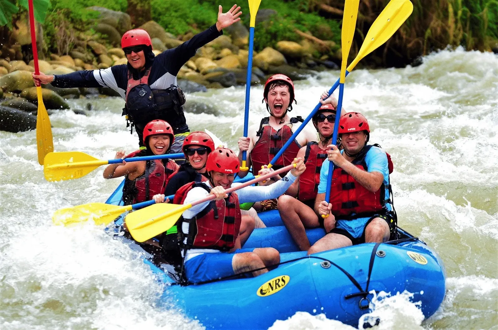 Group rafting through the rainforest on the Savegre River