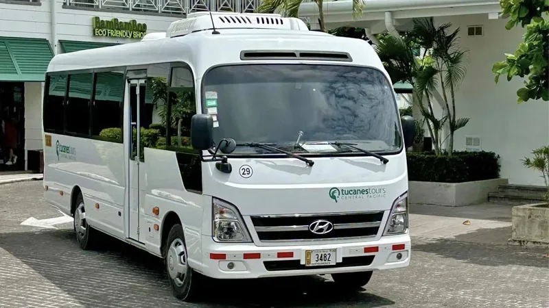 Tucanes Tours Mercedes-Benz shuttle on a Costa Rica coastal road